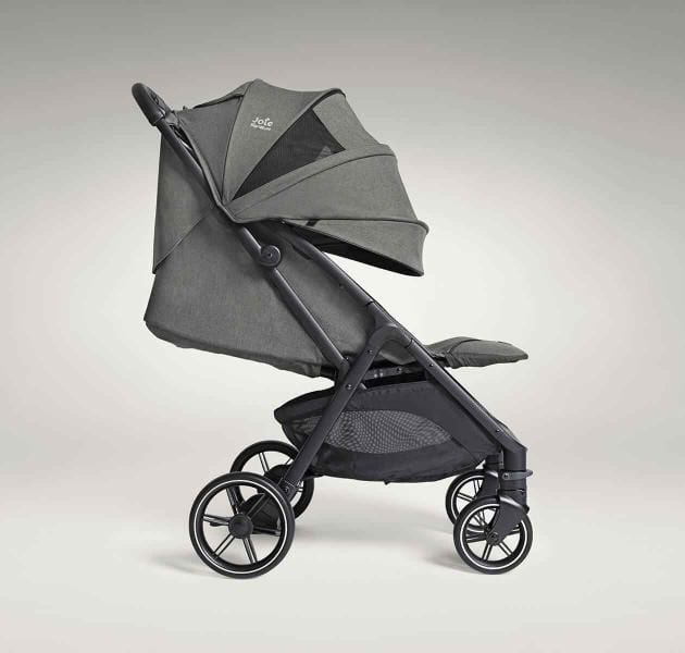 Side view of compact pushchair with fully extended canopy