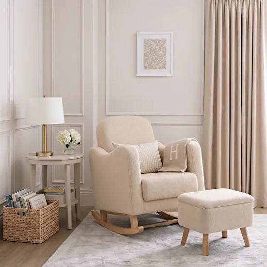 Bebe & Beyond Soother Nursing Chair and Storage Stool in Oat Teddy styled in a neutral cream nursery with natural wood furniture