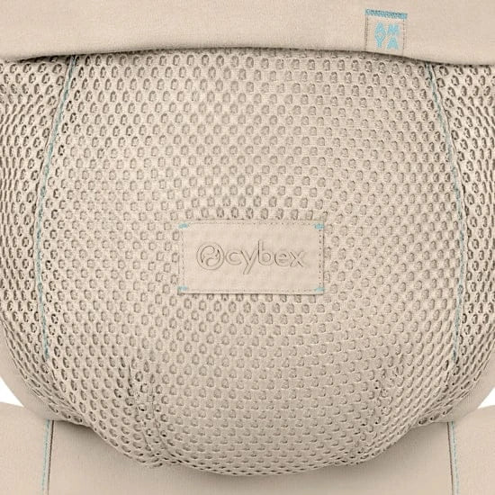 Close-up of the Cybex Amya Baby Carrier mesh panel in Natural Beige, showing breathable honeycomb fabric and embossed Cybex logo