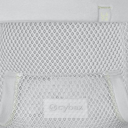 lose-up of the Cybex Laya Baby Carrier mesh back panel in Light Grey, showing open-weave breathable fabric and embossed Cybex logo