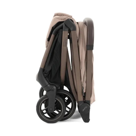 Oyster F-Lite Compact Stroller in Taupe folded and self-standing, showing its compact cabin-size fold
