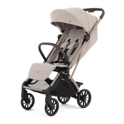 Oyster F-Lite Compact Stroller in Putty with large wheels, champagne frame and brown leatherette handle