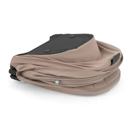 Oyster F-Lite Carrycot in Taupe folded flat for compact storage and travel