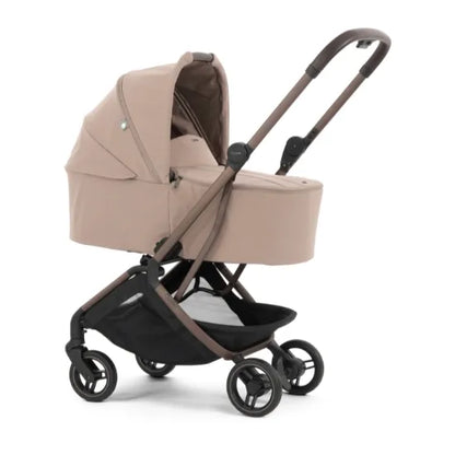 Oyster F-Lite in Taupe in carrycot mode, front three-quarter view with carrycot canopy raised