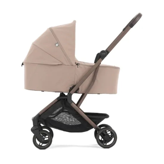 Oyster F-Lite in Taupe in carrycot mode, side view showing the lie-flat carrycot fitted to the compact chassis